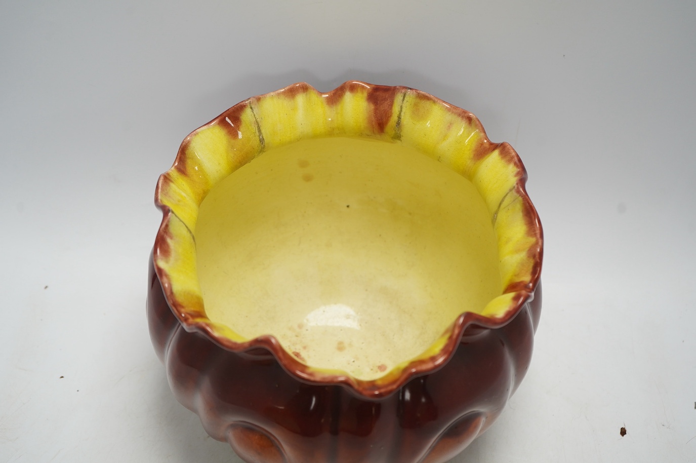 An early 20th century Bretby majolica jardiniere, 19cm. Condition - fair to good